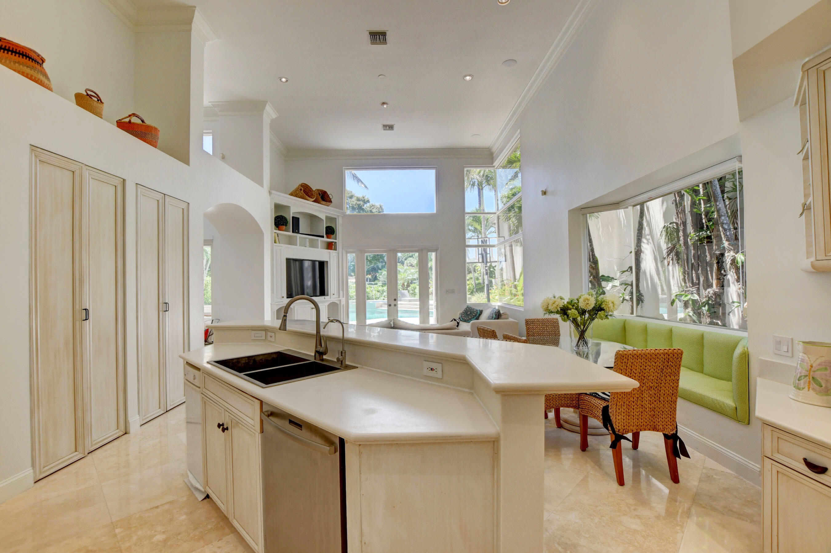 6174 Northwest 24th Way Boca Raton, FL 33496 - Photo 22 of 58 a large kitchen with a table and chairs