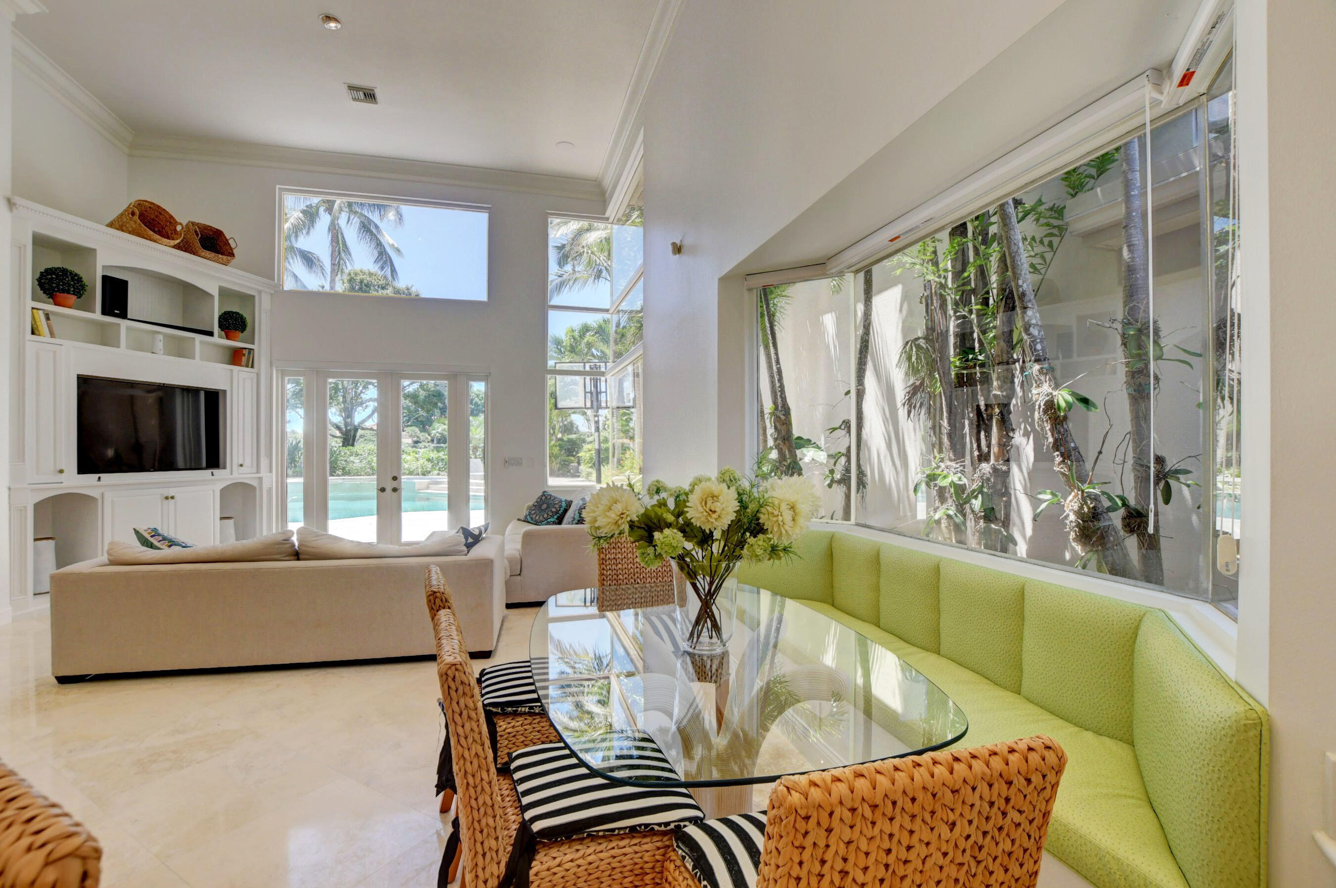 6174 Northwest 24th Way Boca Raton, FL 33496 - Photo 23 of 58 a living room with furniture and a flat screen tv