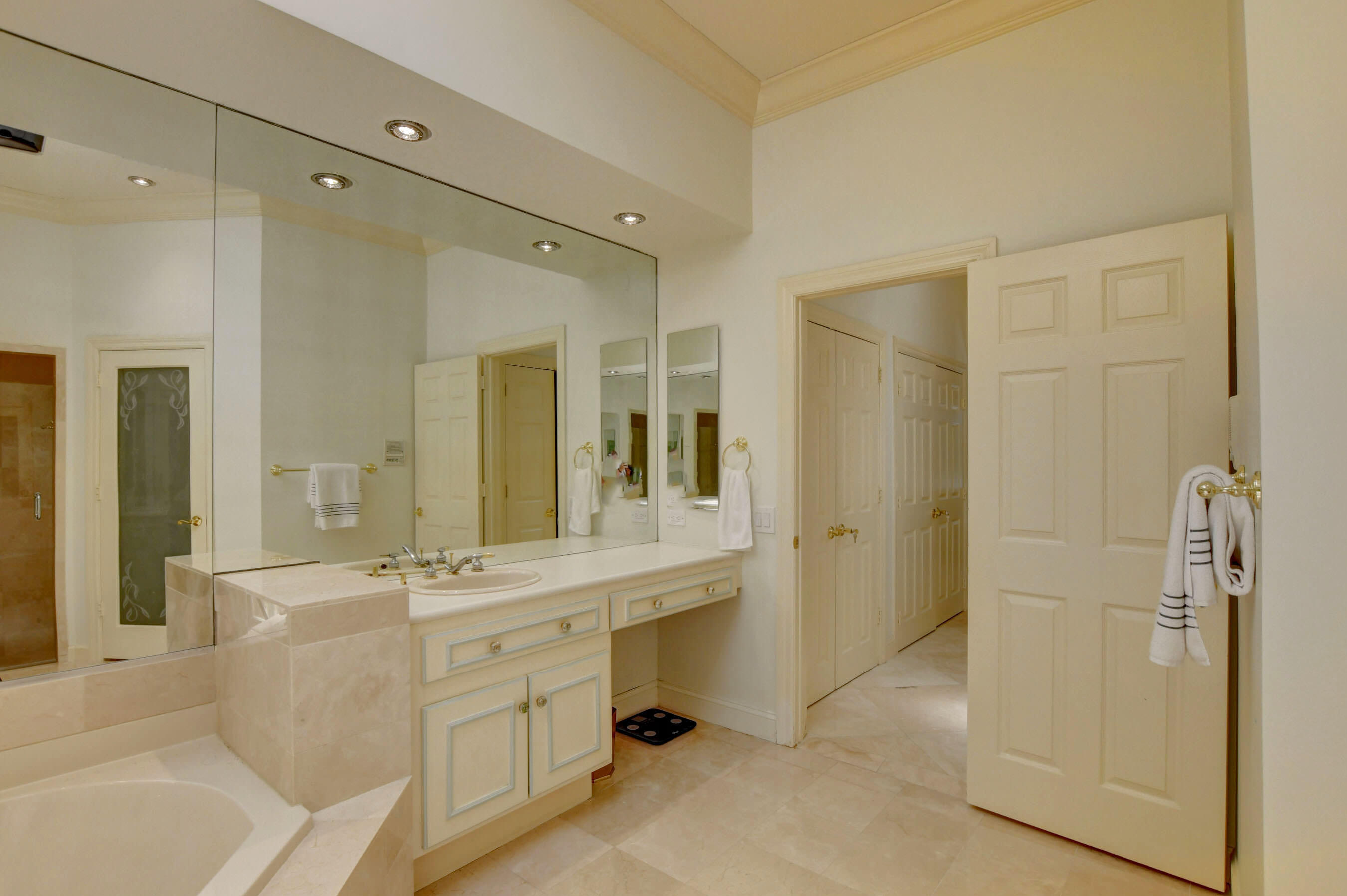 6174 Northwest 24th Way Boca Raton, FL 33496 - Photo 31 of 58 a bathroom with a double vanity sink mirror and shower