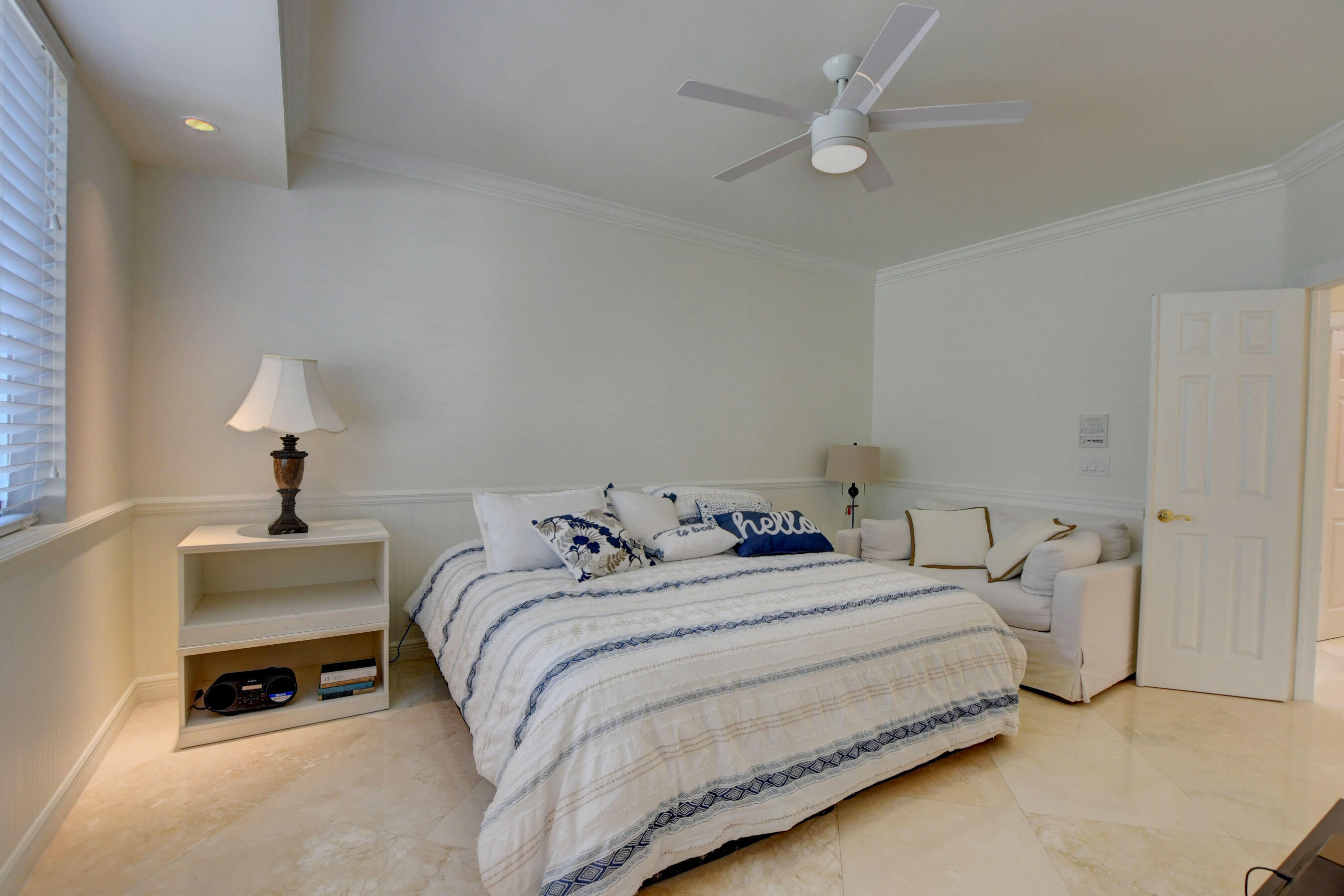 6174 Northwest 24th Way Boca Raton, FL 33496 - Photo 33 of 58 a bedroom with a bed and a lamp