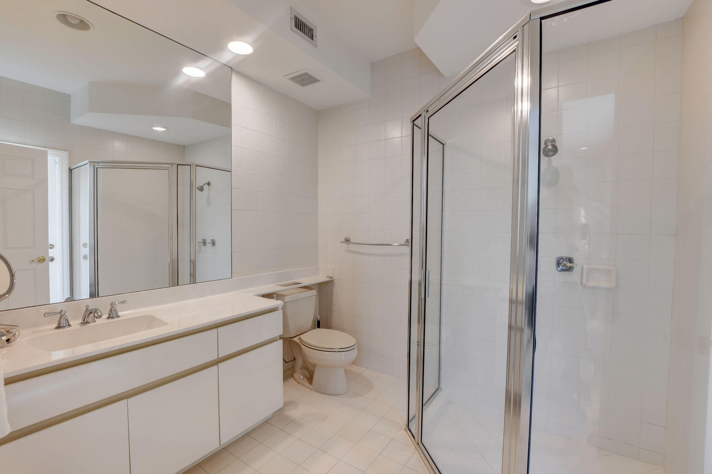 6174 Northwest 24th Way Boca Raton, FL 33496 - Photo 34 of 58 a bathroom with a double vanity sink toilet and shower