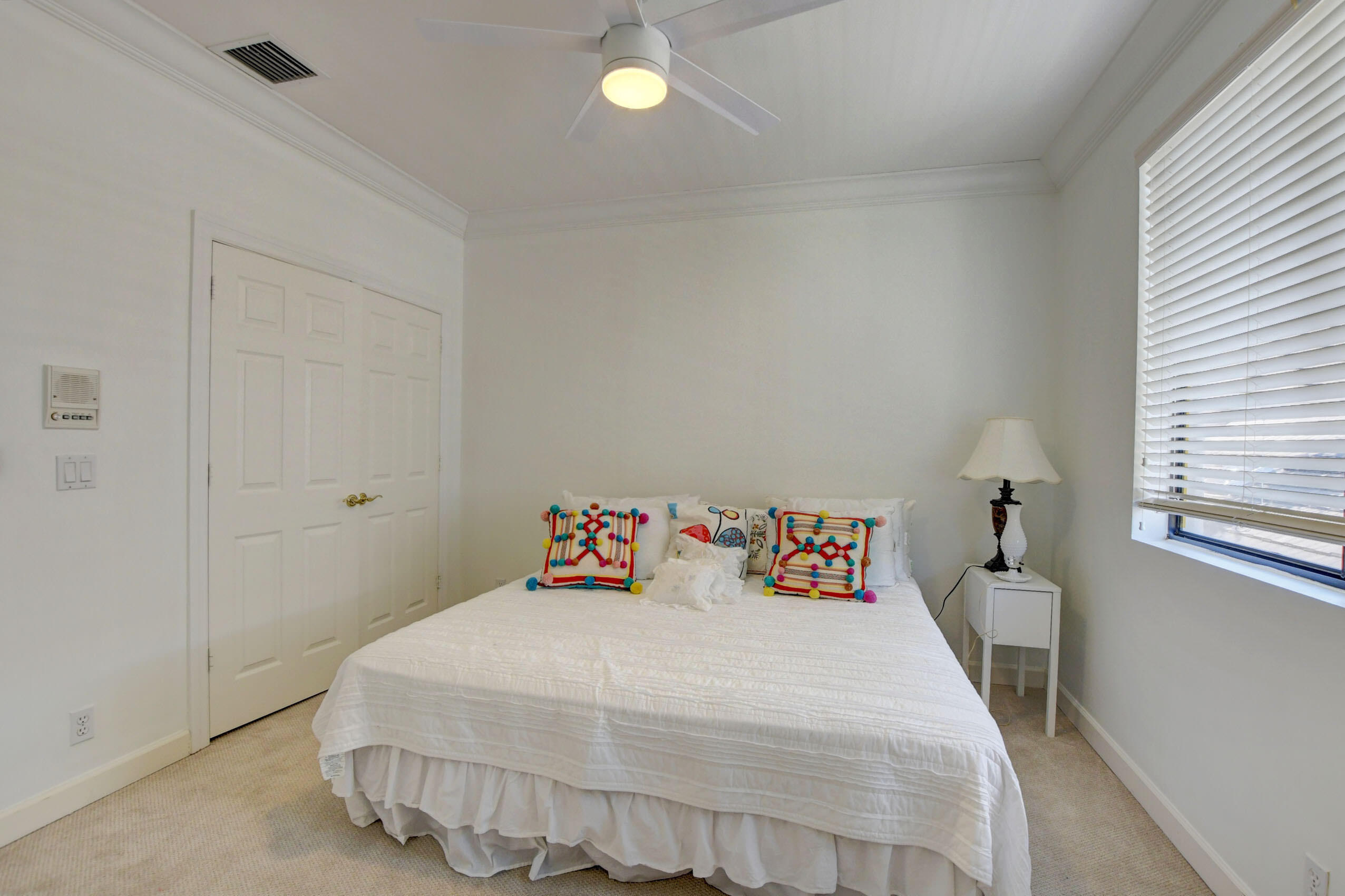 6174 Northwest 24th Way Boca Raton, FL 33496 - Photo 36 of 58 a bedroom with a bed and window
