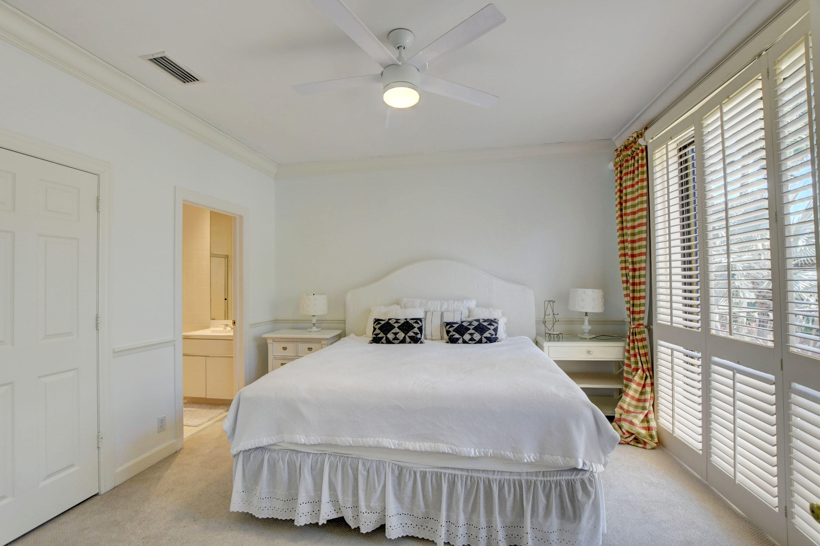 6174 Northwest 24th Way Boca Raton, FL 33496 - Photo 39 of 58 a bedroom with a bed and a window