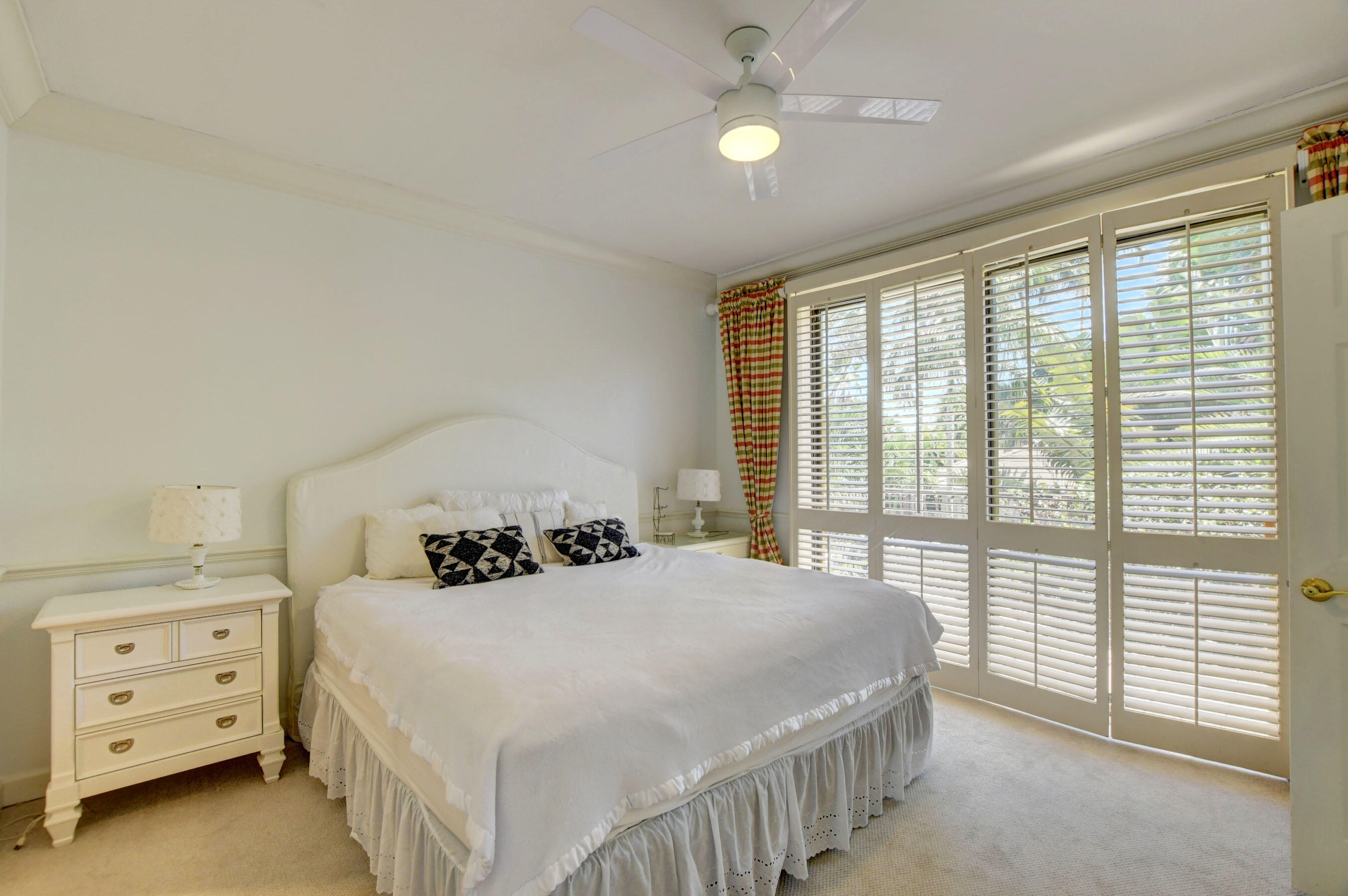 6174 Northwest 24th Way Boca Raton, FL 33496 - Photo 40 of 58 a bedroom with a bed and a window
