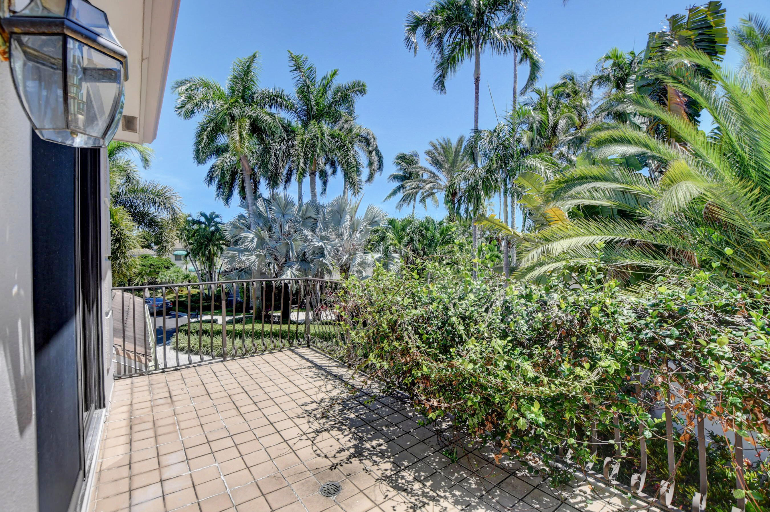 6174 Northwest 24th Way Boca Raton, FL 33496 - Photo 43 of 58 a view of a porch with a garden