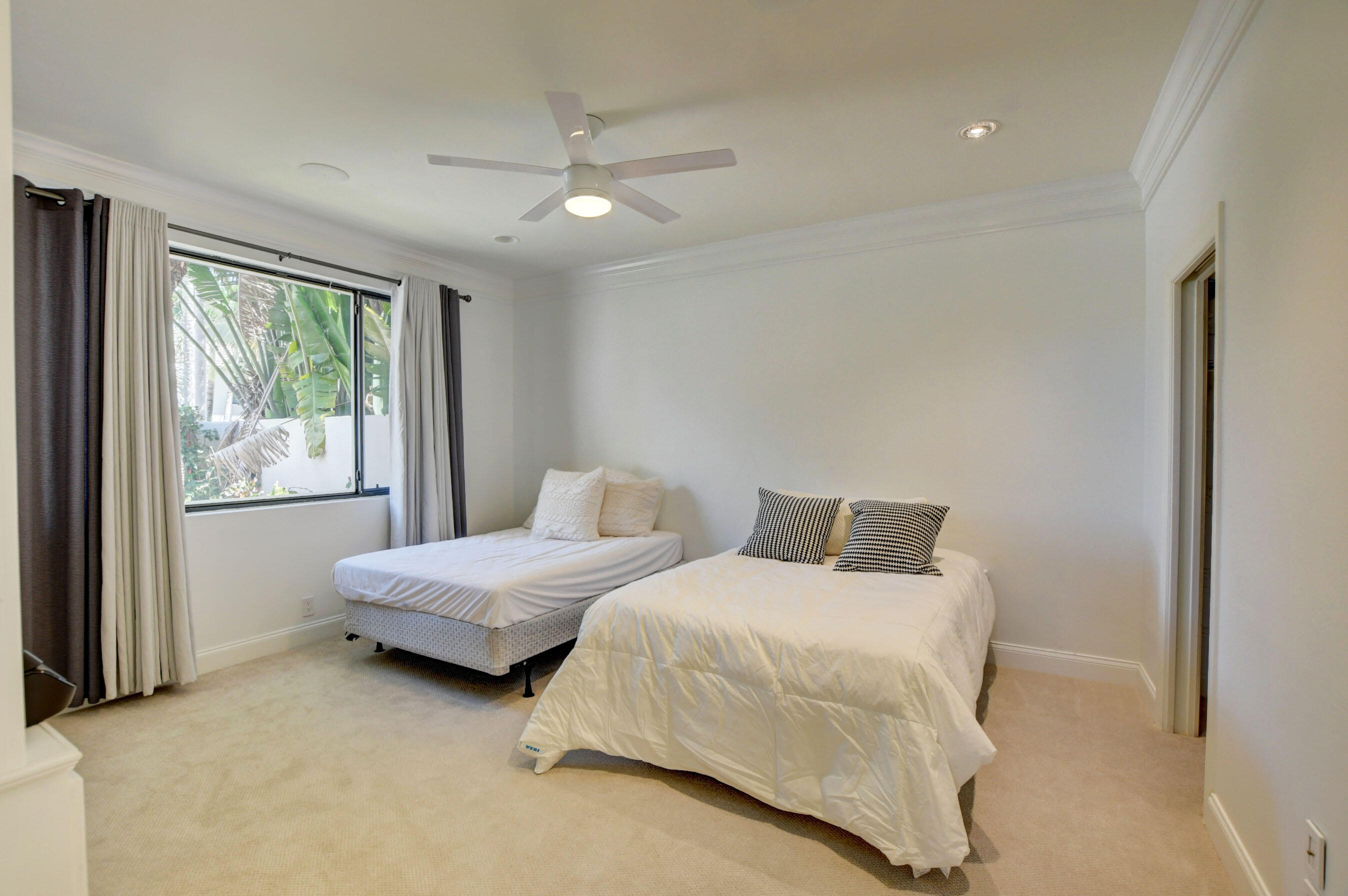 6174 Northwest 24th Way Boca Raton, FL 33496 - Photo 5 of 58 a bedroom with two beds and windows