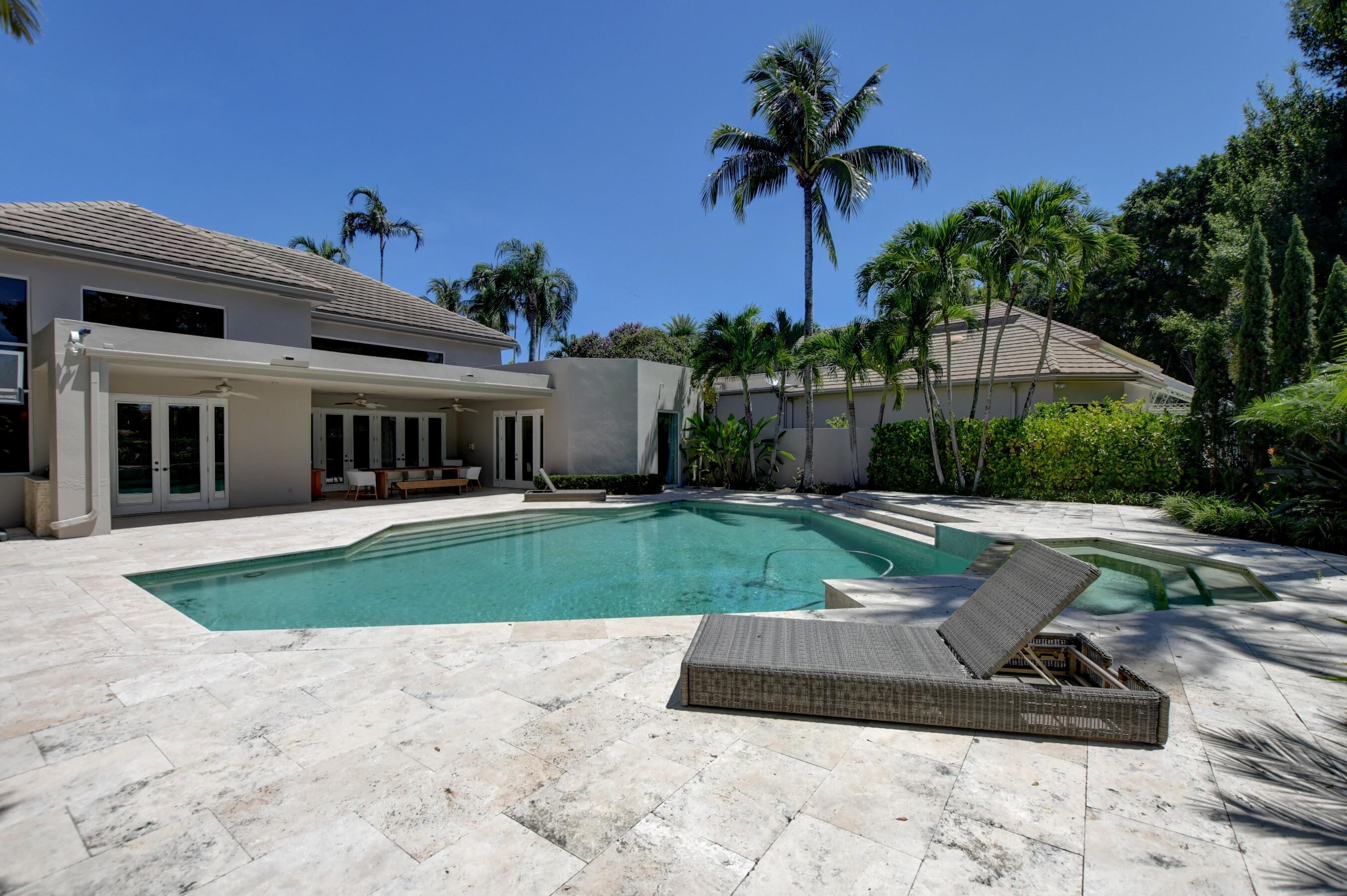 6174 Northwest 24th Way Boca Raton, FL 33496 - Photo 53 of 58 a view of a backyard with a barbeque grill and palm trees