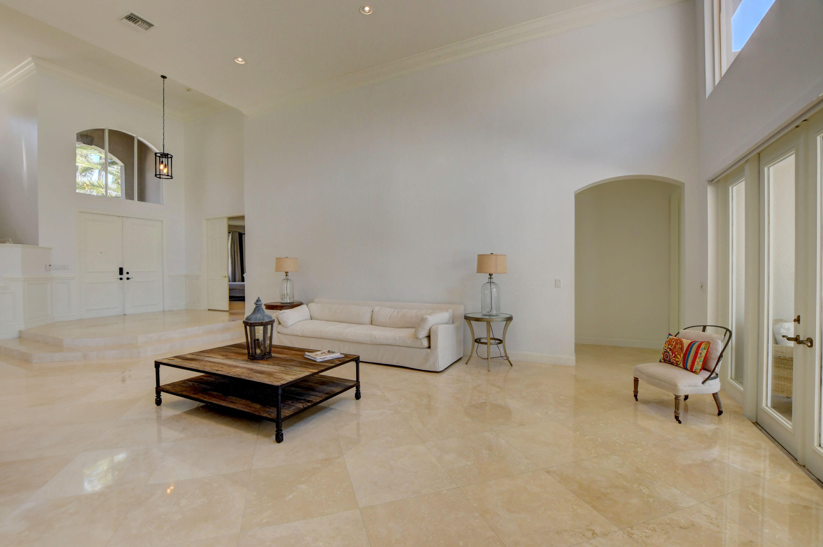 6174 Northwest 24th Way Boca Raton, FL 33496 - Photo 9 of 58 a living room with furniture a rug and a table