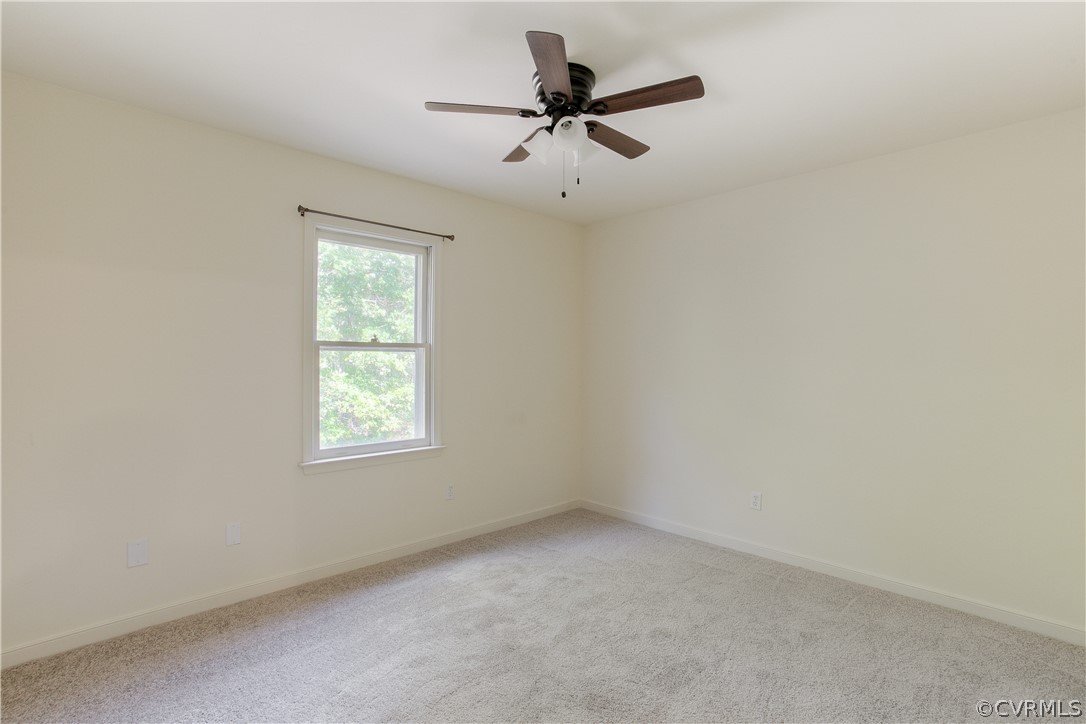 9200 Cattail Road Chesterfield, VA 23838 - Photo 25 of 37 an empty room with a window and a ceiling fan