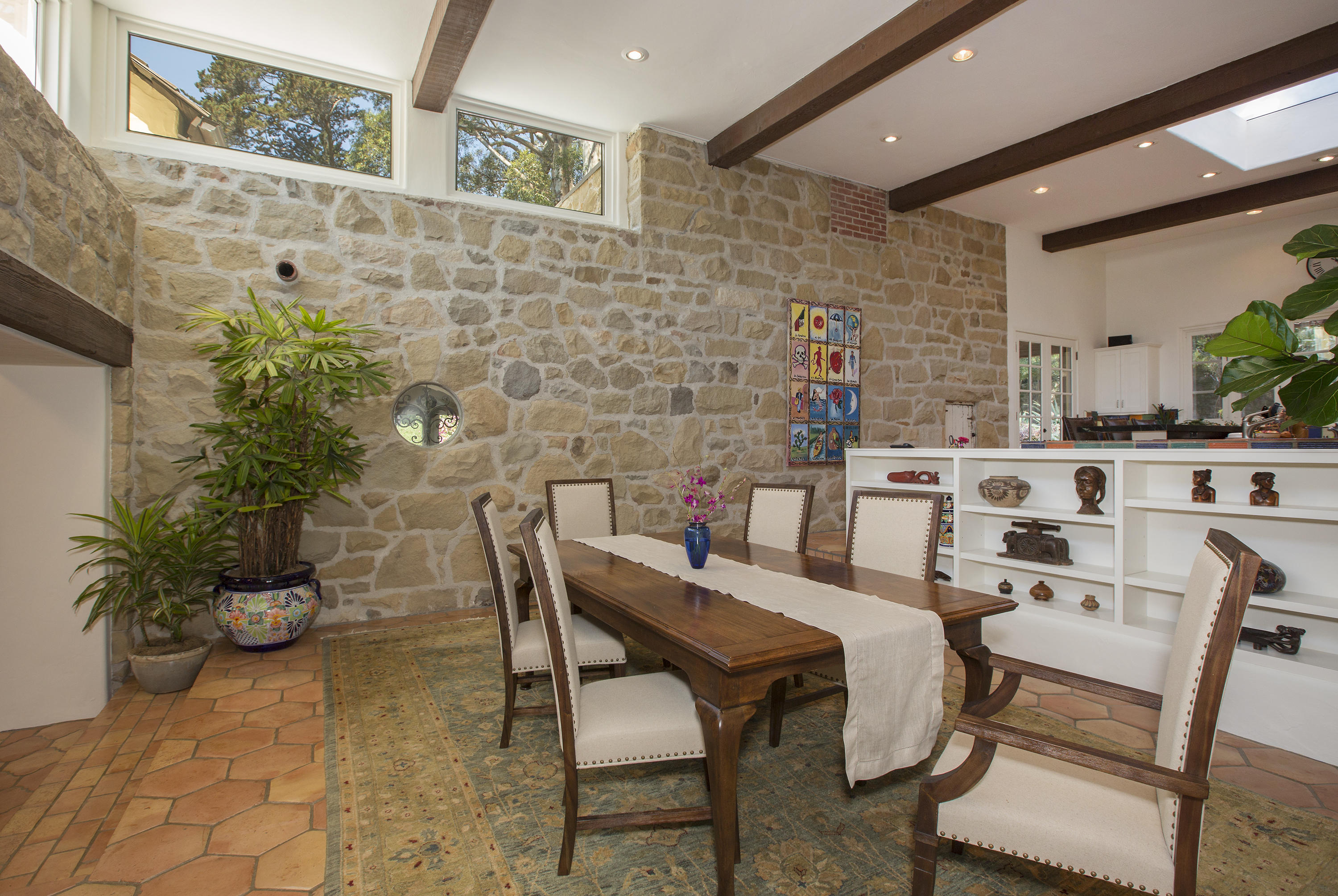 1420 East Valley Road Montecito, CA 93108 - Photo 13 of 17 a dining room with furniture and a potted plant