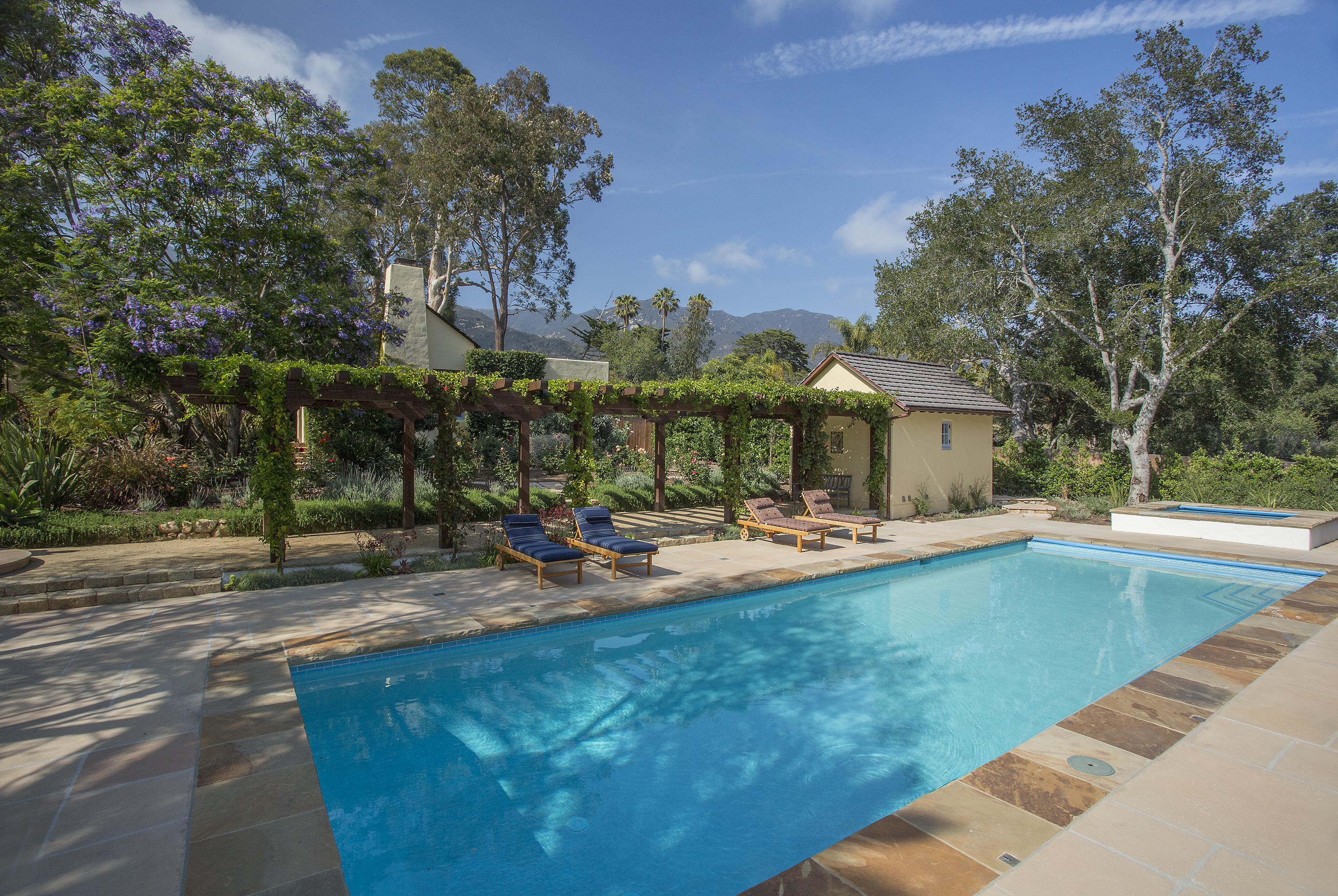 1420 East Valley Road Montecito, CA 93108 - Photo 4 of 17 a view of a house with swimming pool and sitting area