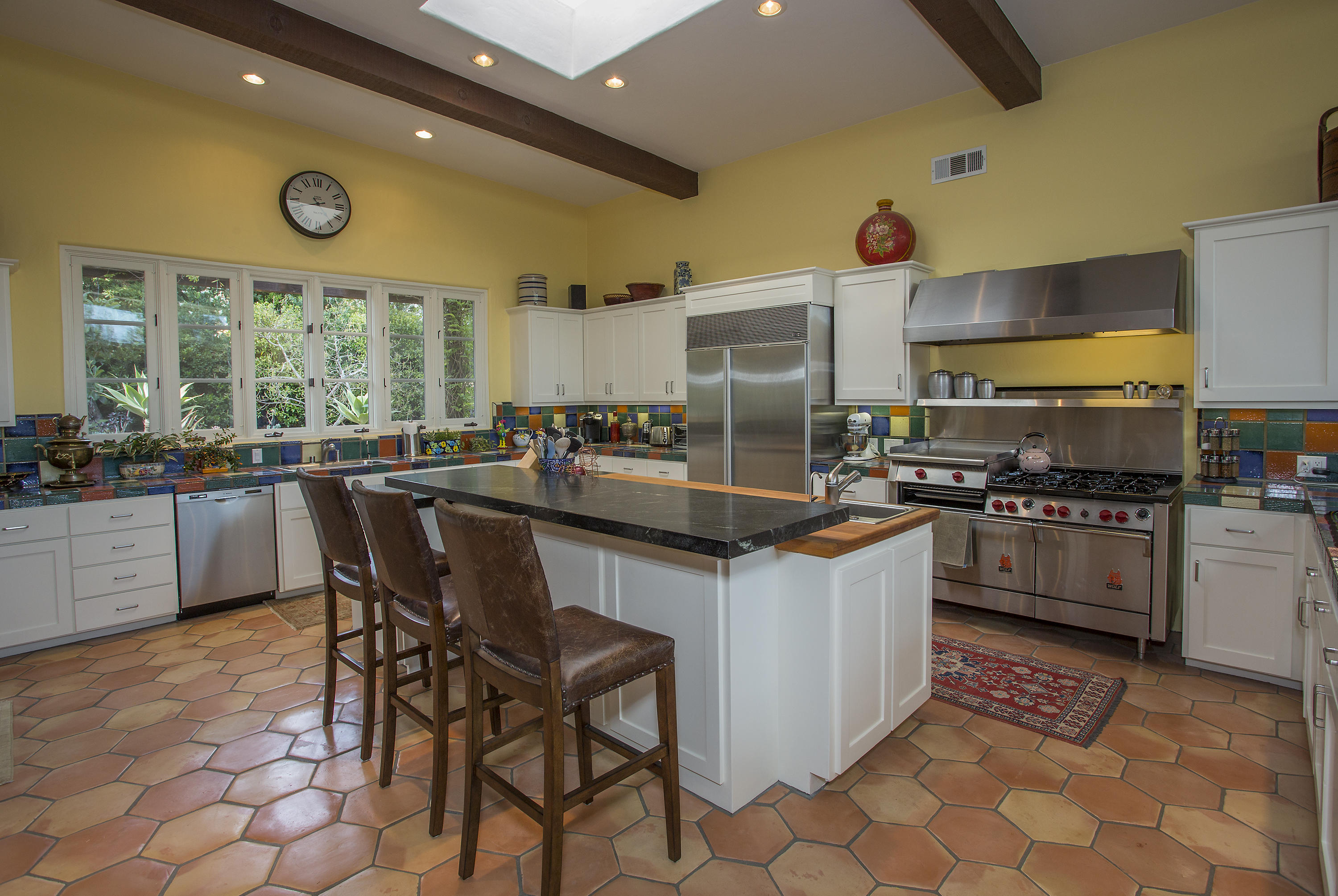 1420 East Valley Road Montecito, CA 93108 - Photo 9 of 17 a kitchen with stainless steel appliances granite countertop a stove a sink and a refrigerator