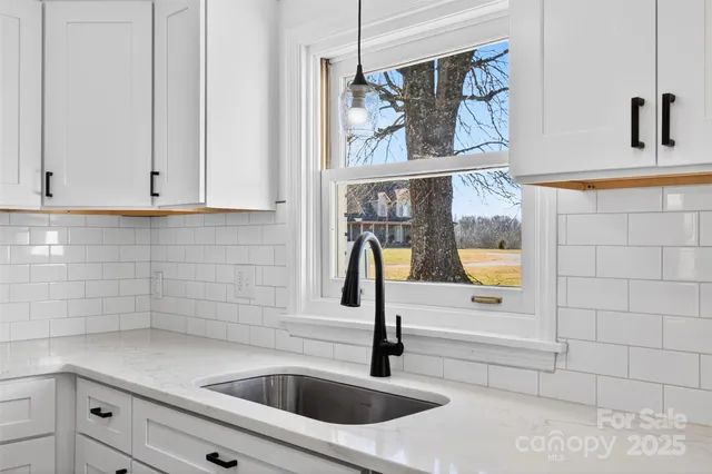 a kitchen with a sink and cabinets