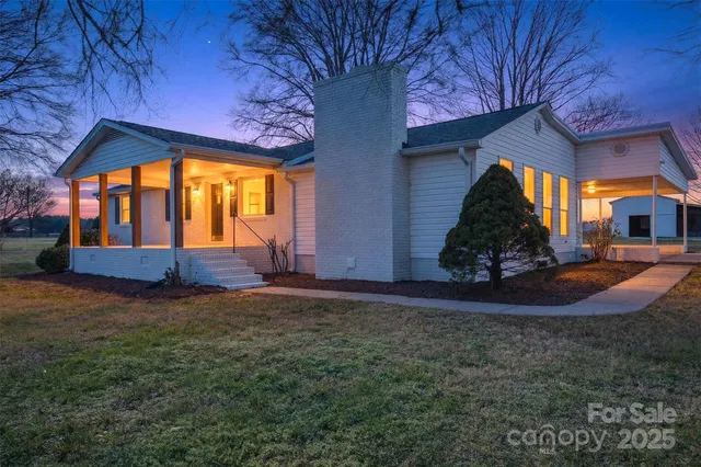 a view of house with backyard and entertaining space