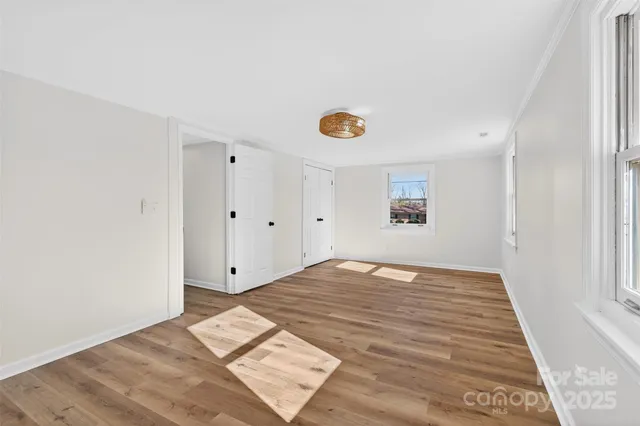 a view of a livingroom with wooden floor