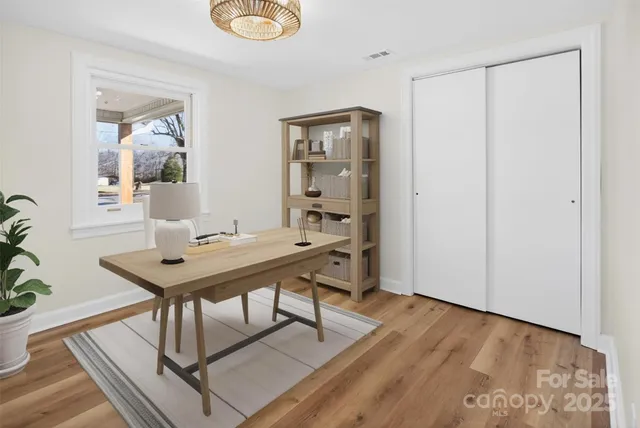 a view of a room that has a table and chairs in it