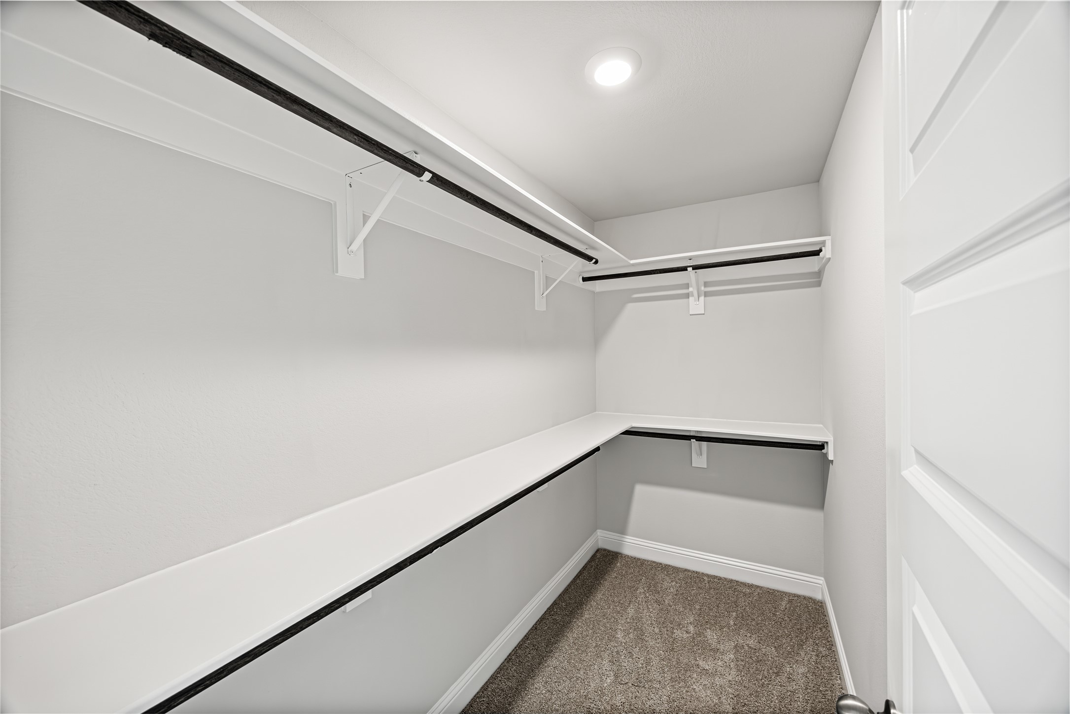 9476 Hard Rock Road Conroe, TX 77303 - Photo 7 of 13 a view of an empty walk in closet