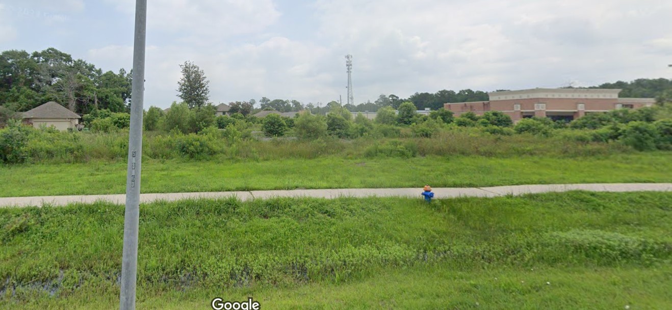 Tbd Mills Branch Road Kingwood, TX 77345 - Photo 5 of 9 a view of a green field with clear sky