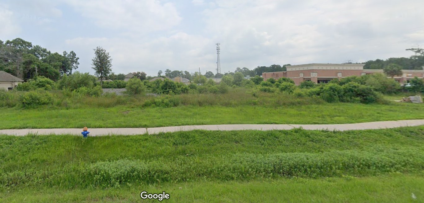 Tbd Mills Branch Road Kingwood, TX 77345 - Photo 6 of 9 a view of a green field with clear sky