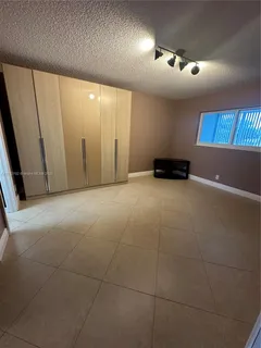 a view of a livingroom with a kitchen