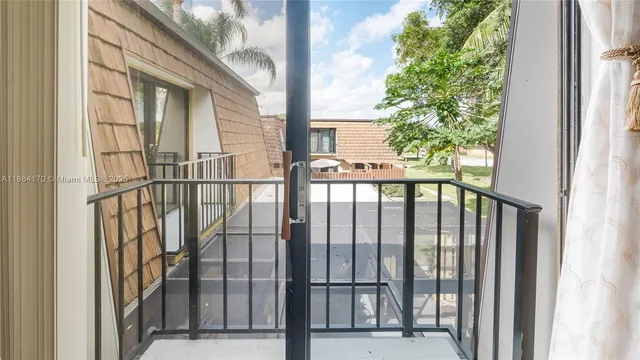 a view of a balcony with a floor to ceiling window