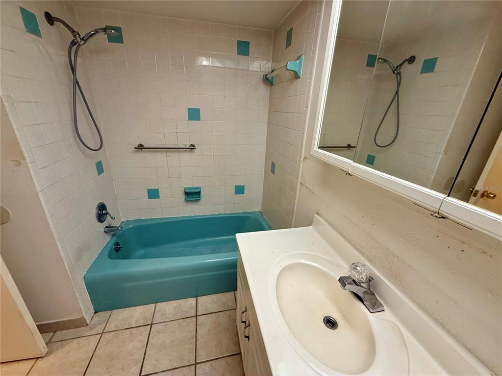 1004 Connecticut Road Tarpon Springs, FL 34689 - Photo 37 of 57 a bathroom with a sink a toilet and shower