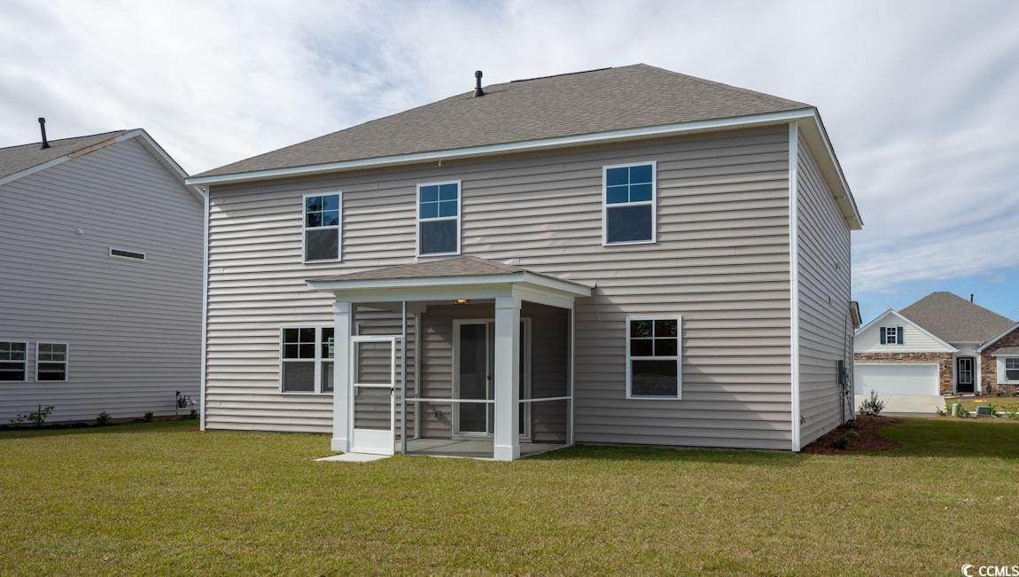 2627 Hudson Trail Conway, SC 29526 - Photo 2 of 20 Rear view of house with a yard, a shingled roof, and a sunroom
