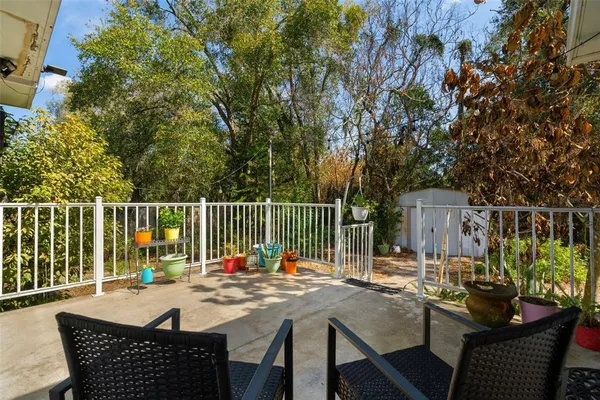 a view of a patio with a table chairs and a table