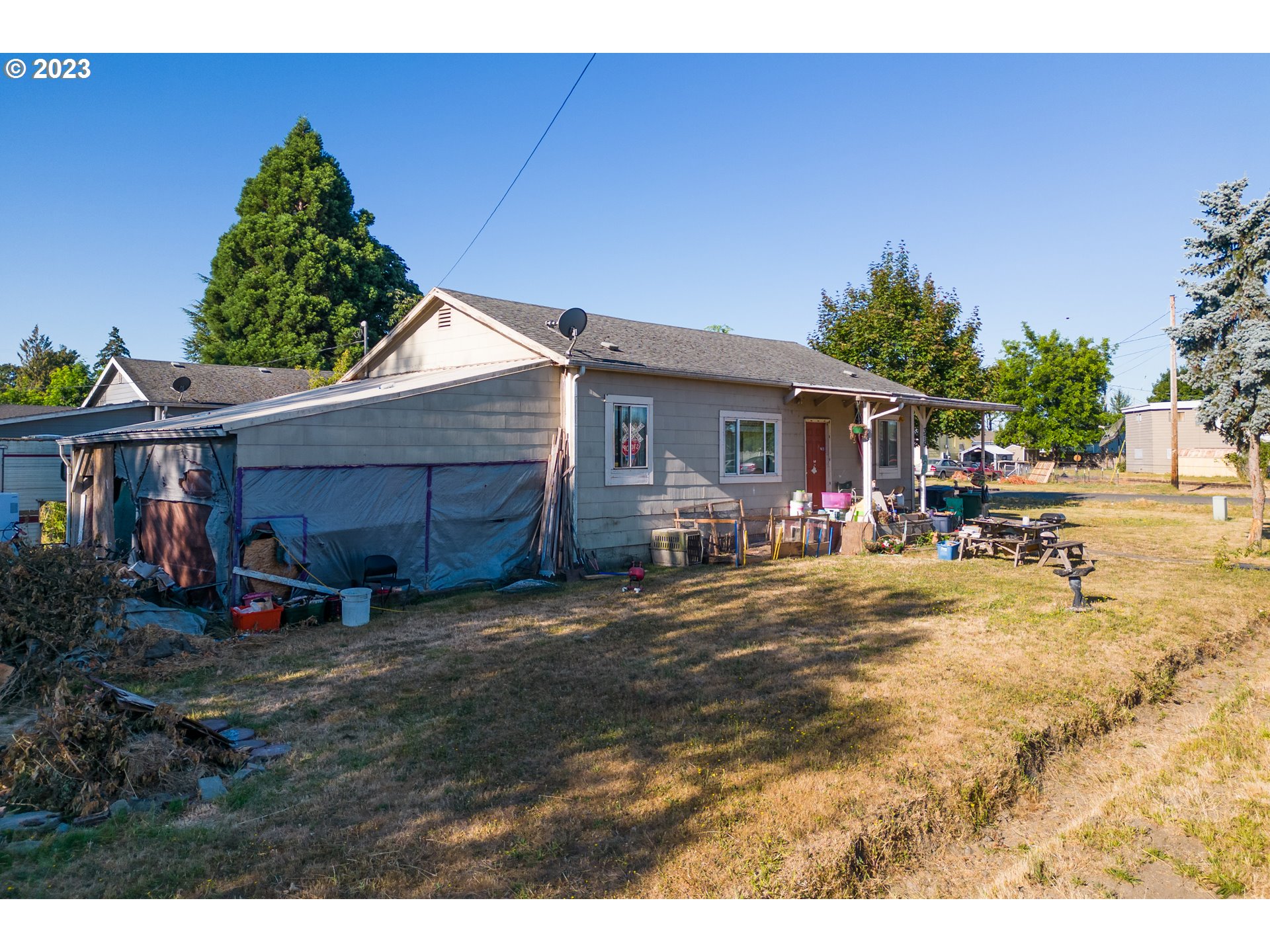 375 Picture Street Independence, OR 97351 - Photo 2 of 5 a backyard of a house with table and chairs