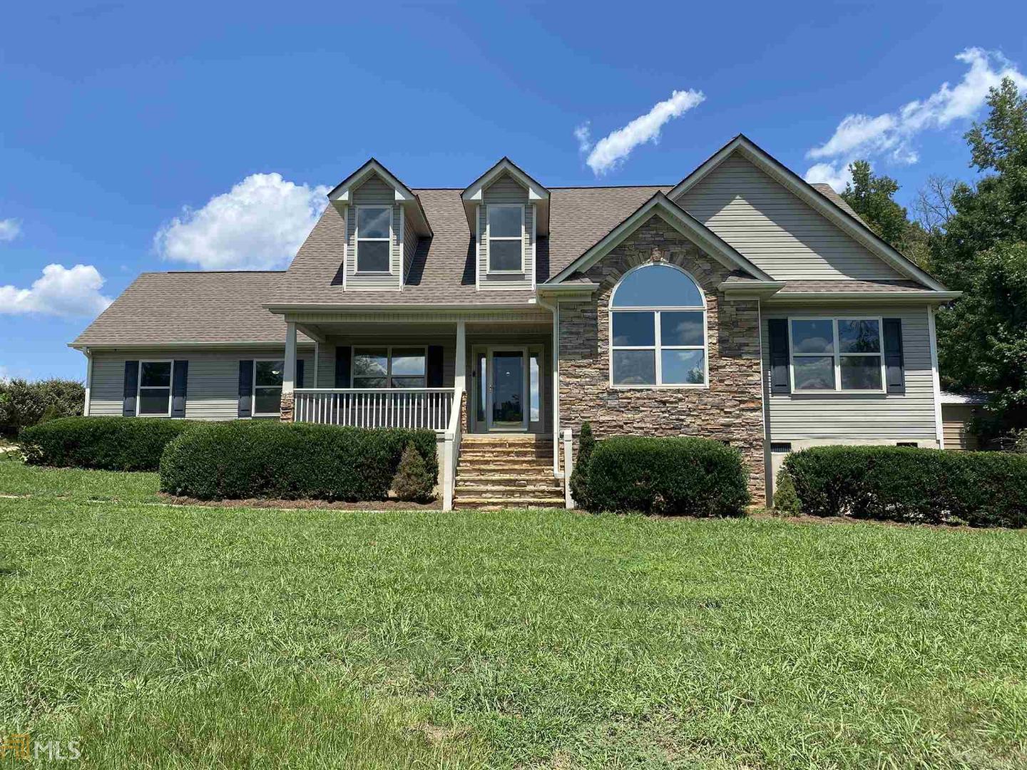 259 Manley Road, Unit LL 89 Griffin, GA 30223 - Photo 1 of 1 a front view of a house with a yard