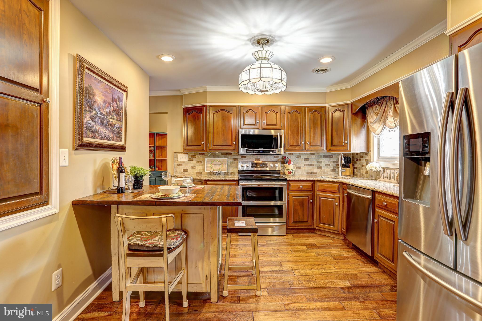 100 Oakmere Road Owings Mills, MD 21117 - Photo 7 of 38 Kitchen equipped w/ SS appliances