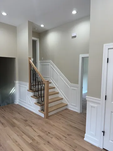 a view of entryway with wooden floor