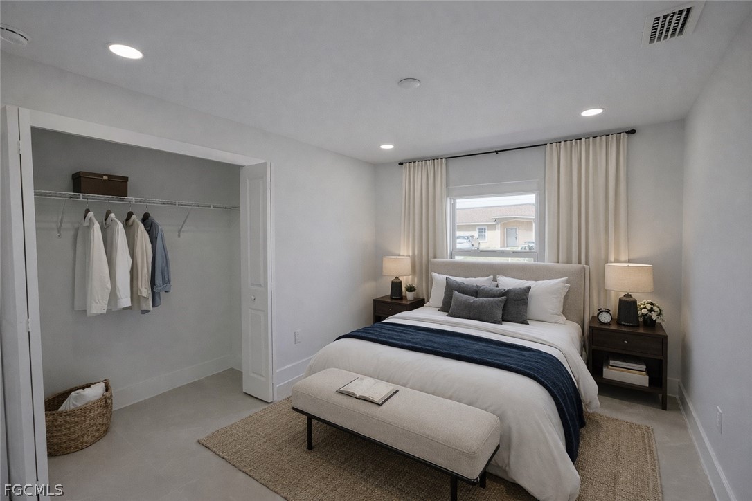 4529 18th Street Southwest Lehigh Acres, FL 33973 - Photo 15 of 50 a bedroom with a bed and a window