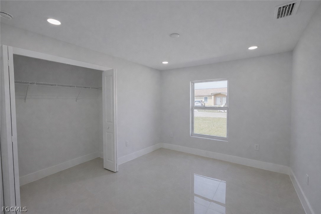 4529 18th Street Southwest Lehigh Acres, FL 33973 - Photo 16 of 50 an empty room with windows