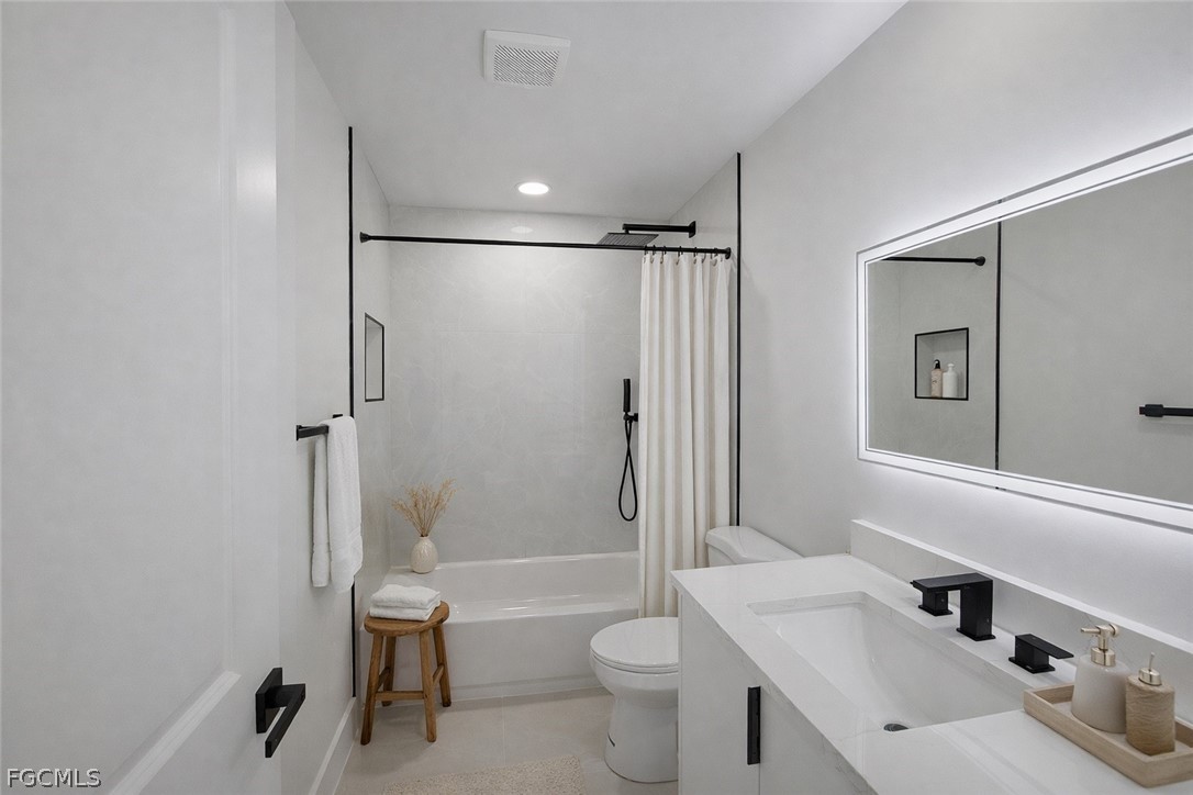 4529 18th Street Southwest Lehigh Acres, FL 33973 - Photo 17 of 50 a bathroom with a sink toilet tub and shower