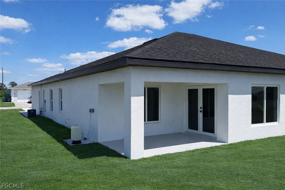 4529 18th Street Southwest Lehigh Acres, FL 33973 - Photo 22 of 50 a view of a house with backyard