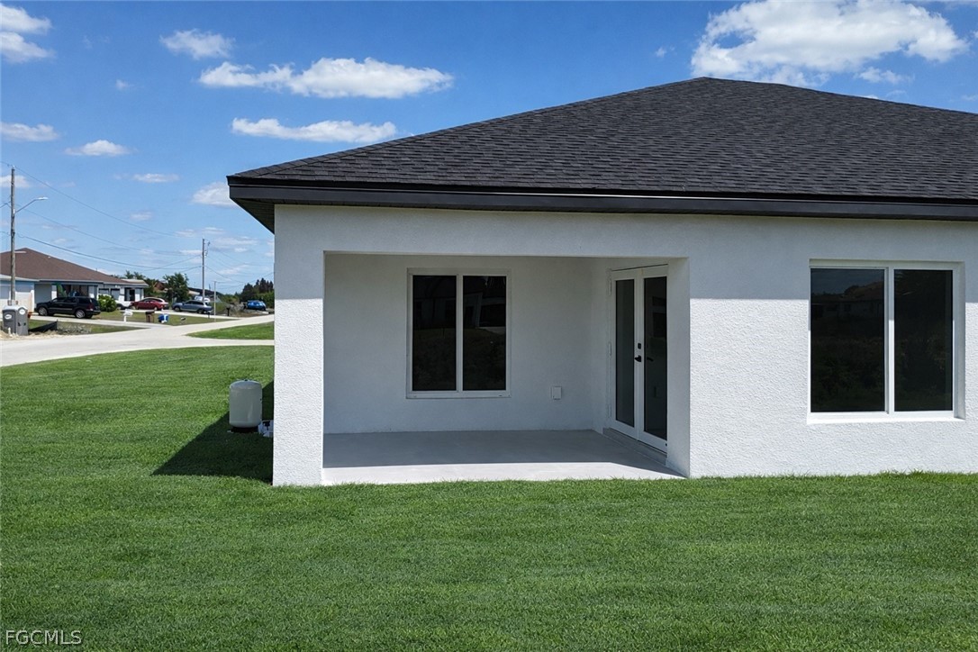 4529 18th Street Southwest Lehigh Acres, FL 33973 - Photo 23 of 50 a front view of house with yard