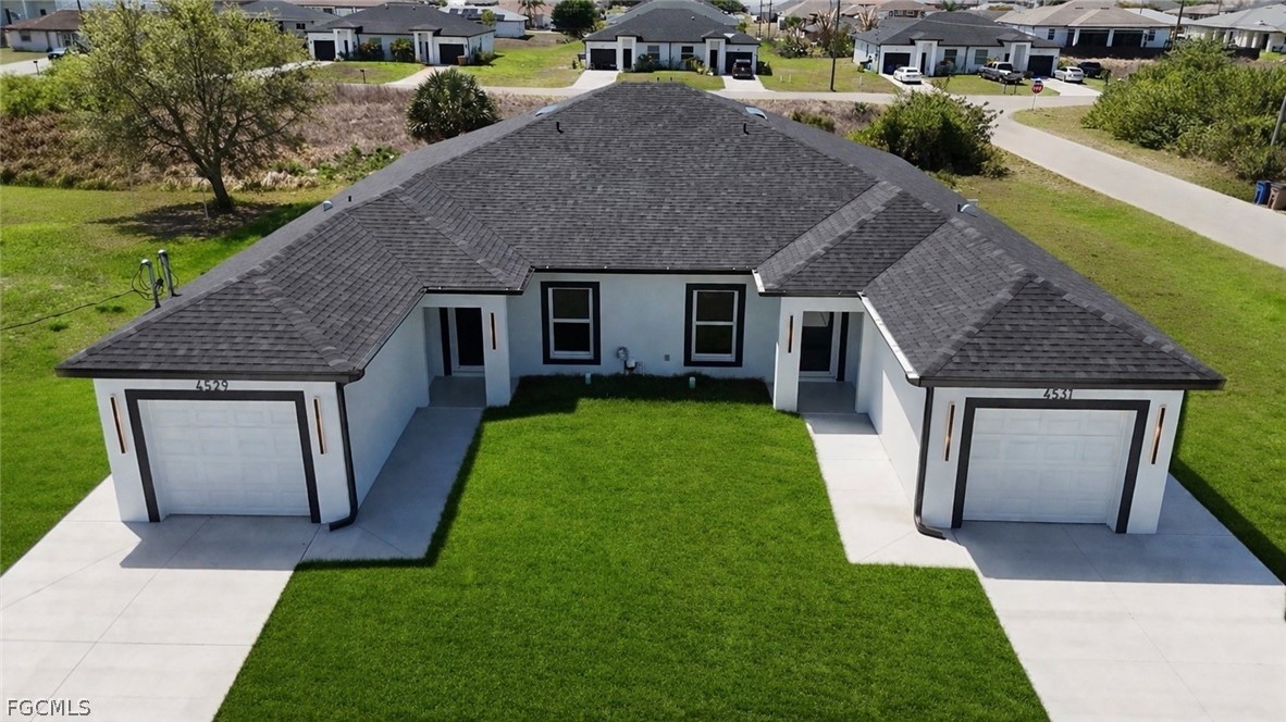 4529 18th Street Southwest Lehigh Acres, FL 33973 - Photo 25 of 50 a house view with a garden space