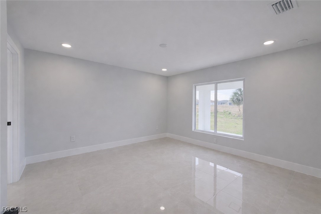 4529 18th Street Southwest Lehigh Acres, FL 33973 - Photo 35 of 50 an empty room with a window
