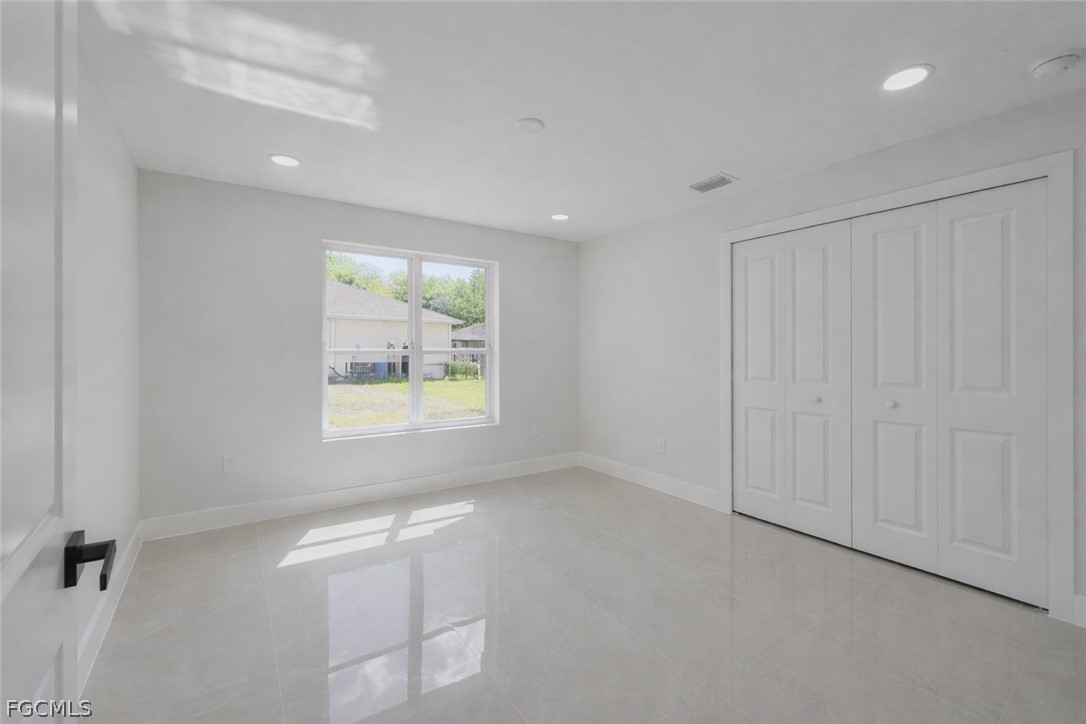 4529 18th Street Southwest Lehigh Acres, FL 33973 - Photo 40 of 50 a view of an empty room with a window