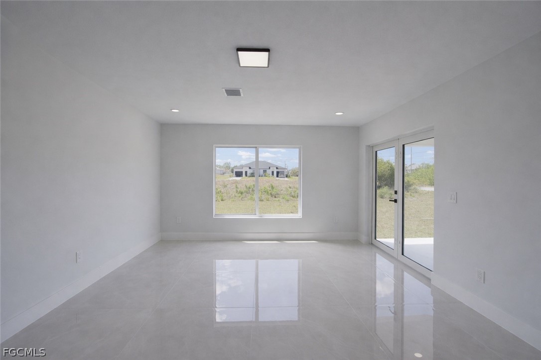 4529 18th Street Southwest Lehigh Acres, FL 33973 - Photo 4 of 50 an empty room with windows