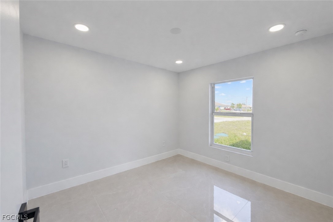 4529 18th Street Southwest Lehigh Acres, FL 33973 - Photo 43 of 50 a view of an empty room with a window