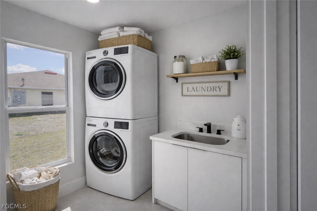 4529 18th Street Southwest Lehigh Acres, FL 33973 - Photo 44 of 50 a utility room with dryer and washer