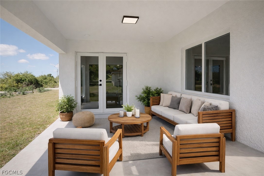 4529 18th Street Southwest Lehigh Acres, FL 33973 - Photo 50 of 50 a living room with furniture and a large window