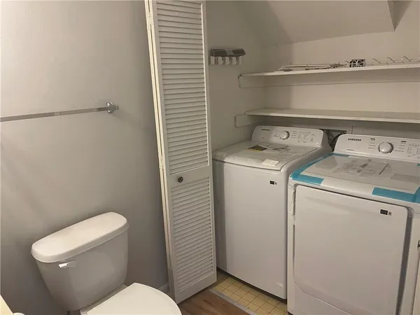 a bathroom with a toilet and a sink