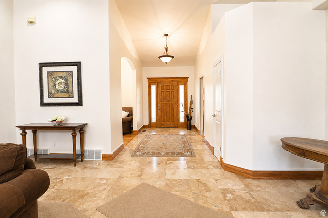 1055 North 1000 East Mapleton, UT 84664 - Photo 20 of 112 Foyer featuring natural wood double entry doors, neutral tile flooring, and high ceilings with recessed lighting