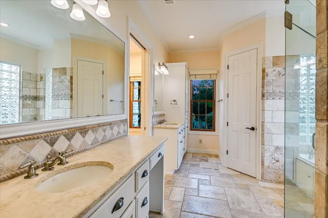 a bathroom with a bathtub and shower