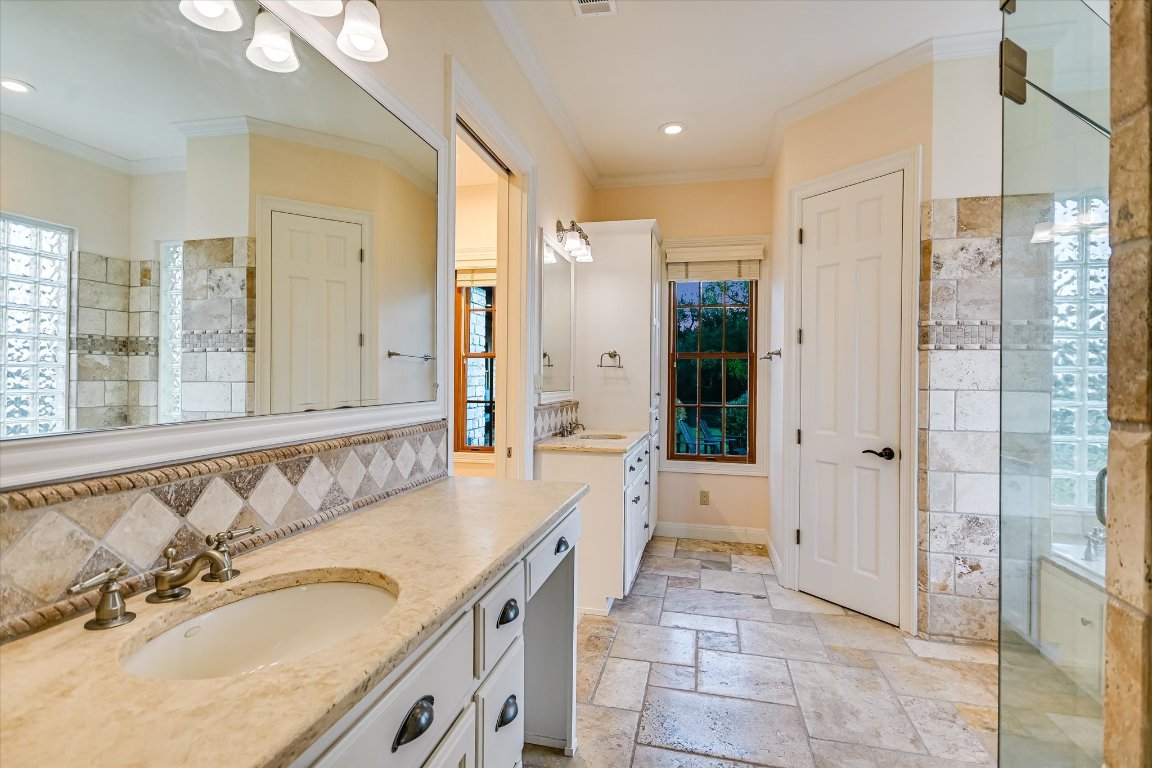 1050 River Mountain Road, Unit A Wimberley, TX 78676 - Photo 14 of 40 a large bathroom with a granite countertop tub sink a mirror and a shower