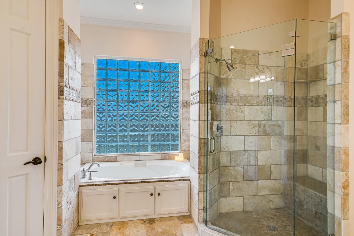 1050 River Mountain Road, Unit A Wimberley, TX 78676 - Photo 15 of 40 a bathroom with a bathtub and shower