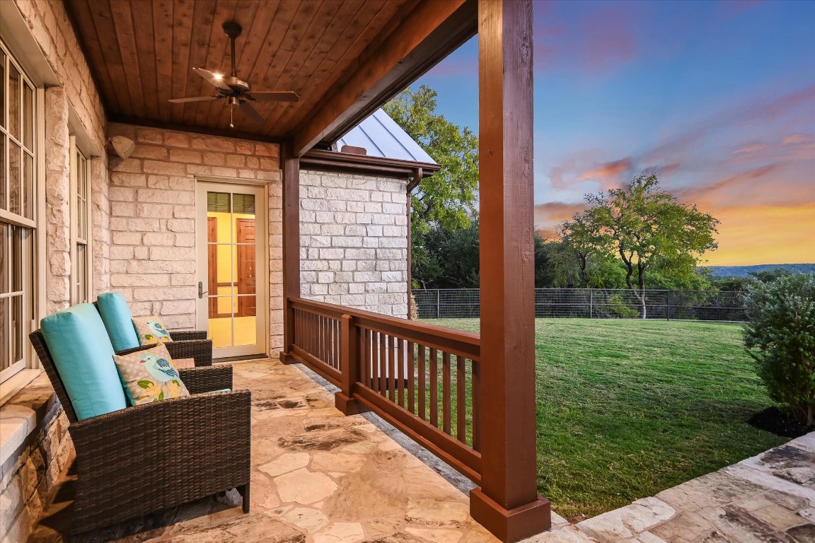 1050 River Mountain Road, Unit A Wimberley, TX 78676 - Photo 23 of 40 a view of a porch with furniture and garden